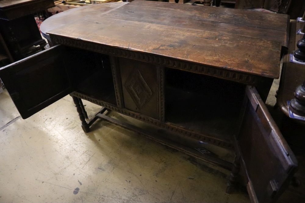 A Tudor style carved oak sideboard, width 119cm depth 36cm height 80cm